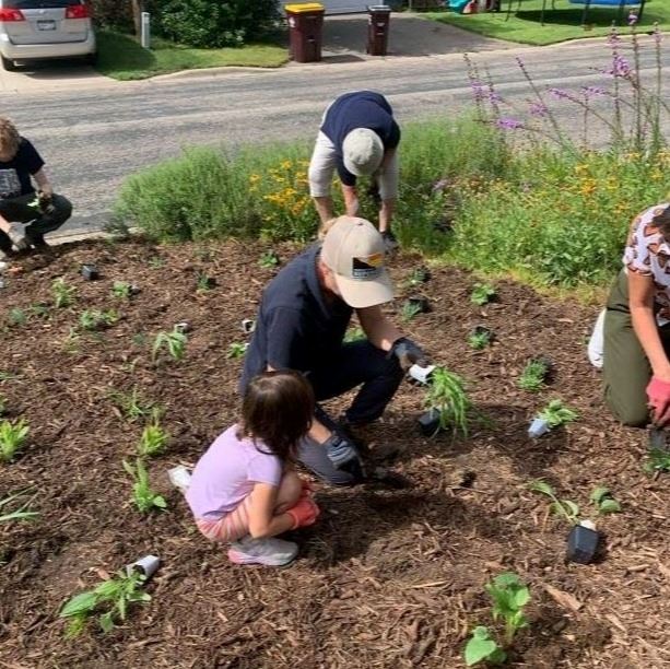 Volunteers planting a garden